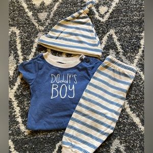 Blue “daddy’s boy” onesie, striped pants, striped hat